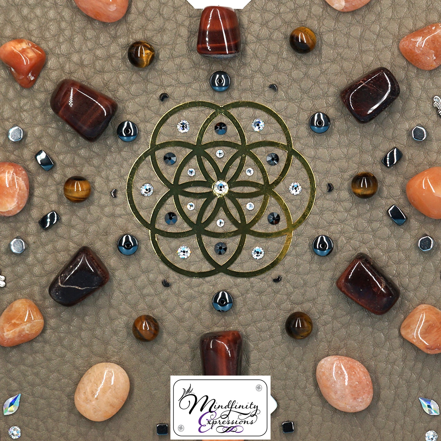 shadow box art, 18K gold Flower of Life sacred geometry medallion, Natuzzi Italia genuine leather, crystals, Swarovski crystals, gemstones, gems, sacred geometry, healing art, crystal art, crystal grid, energy healing, crystal healing, crystal energy, crystal grid, healing, healing energy, healing art, sacred geometry, handmade, luxury art, Orange Aventurine, Red Tiger Eye, Tiger Eye, King Quartz, Hematite, Mother of Pearl 